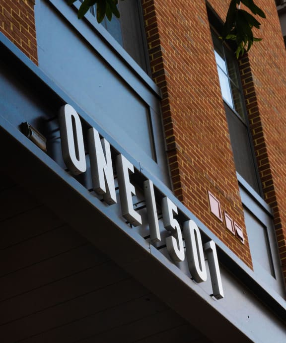 a neon sign on the side of a building