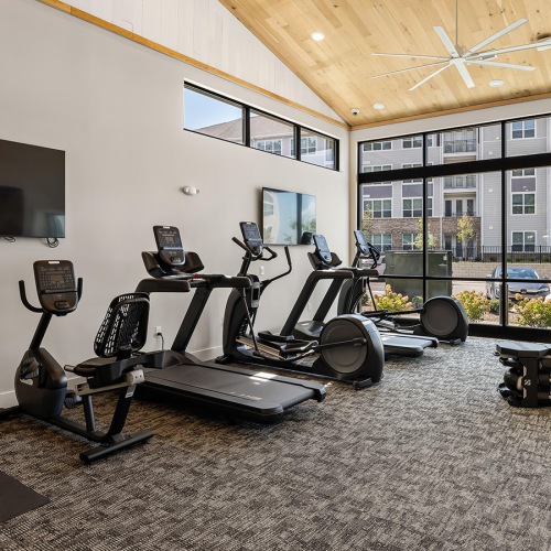 high ceilings and large windows in fitness center