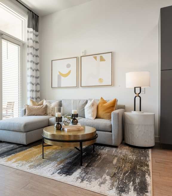 a living room with a leather couch and a coffee table