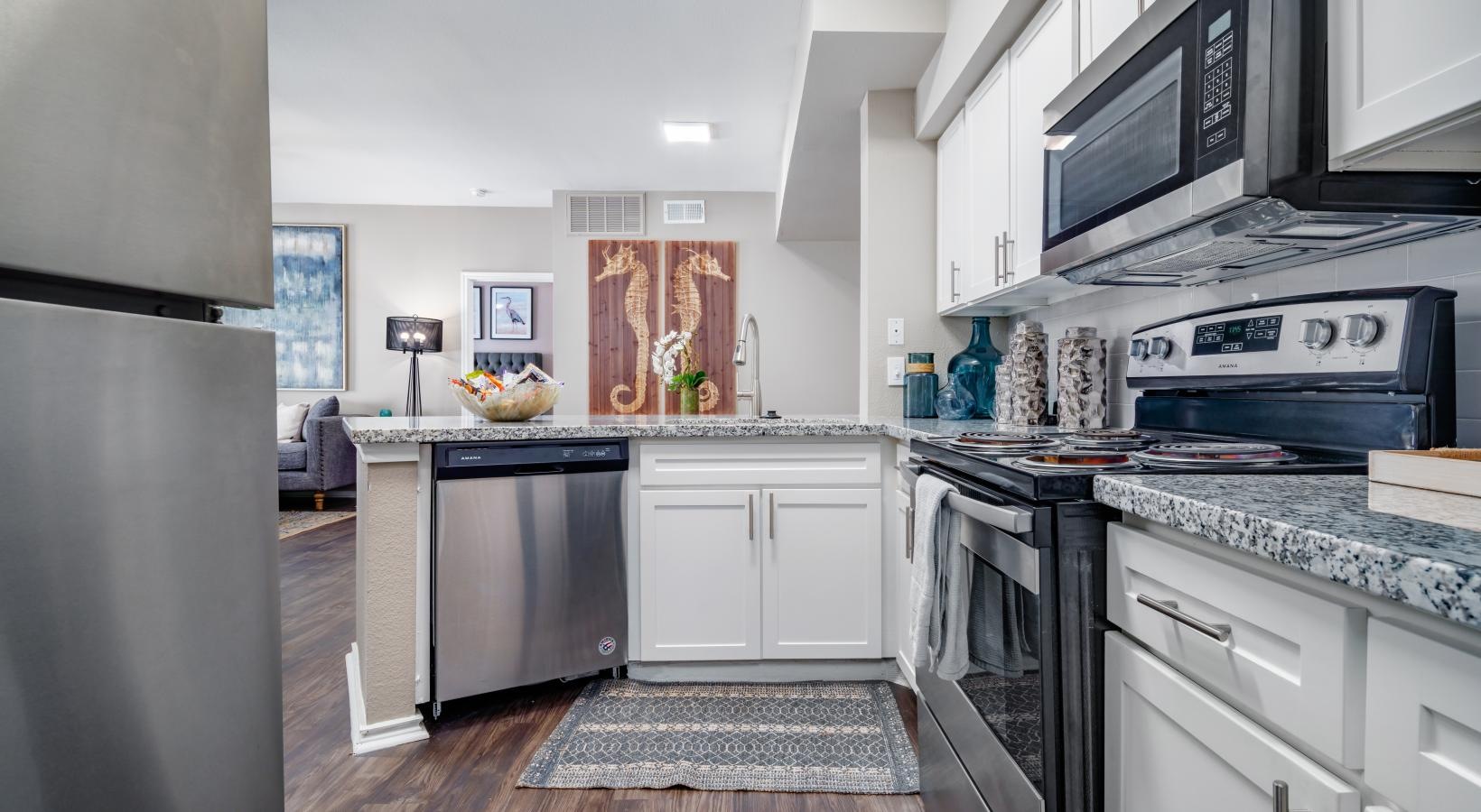 a kitchen with white cabinets