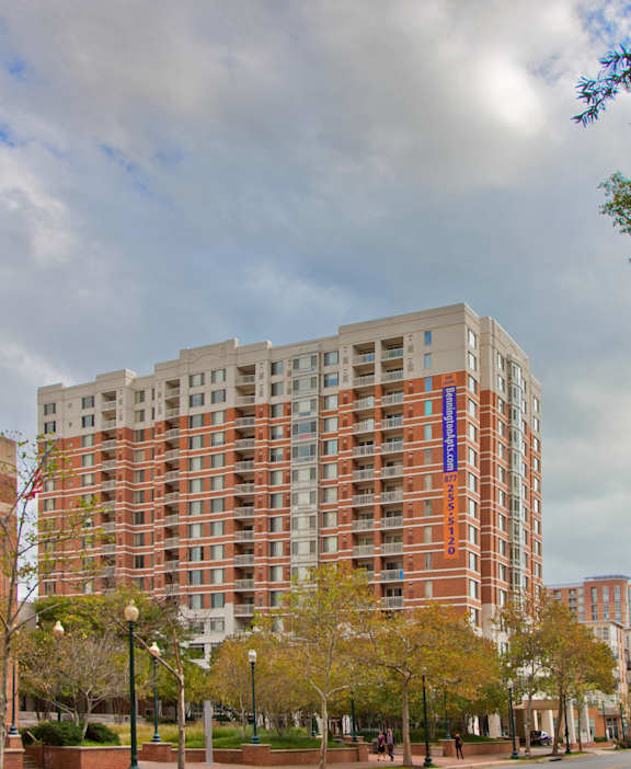 a large apartment building with a street in front of it