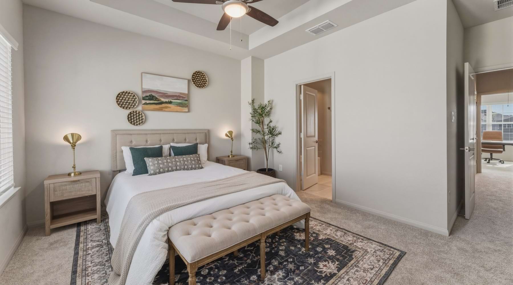 a bedroom with a bed and two nightstands