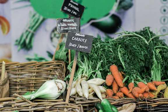 a variety of vegetables on display at a market