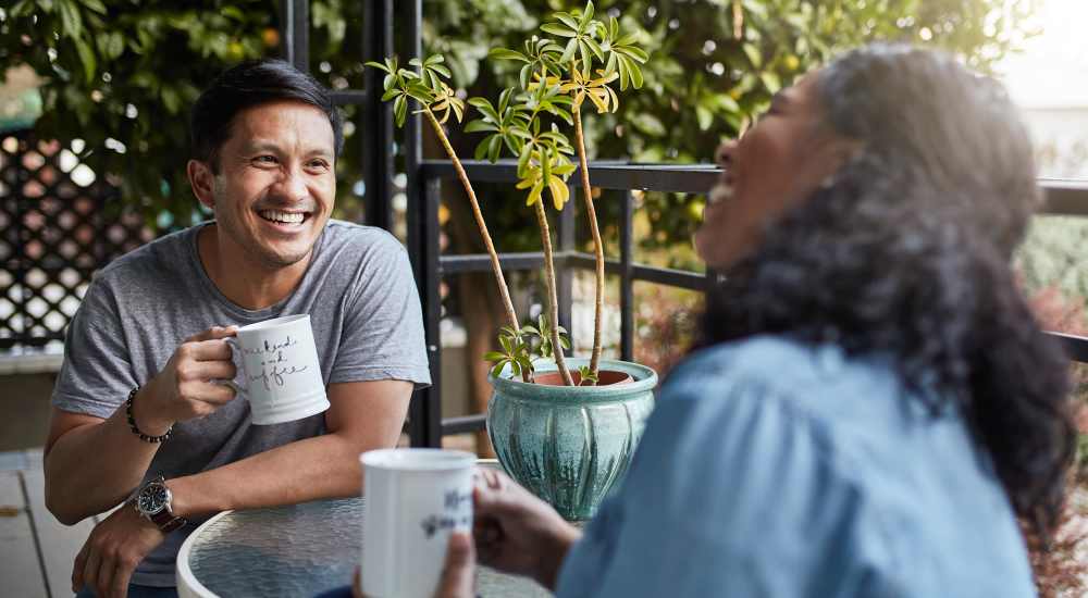 Residents drinking coffee near Grand Oak Apartments in Largo, Florida