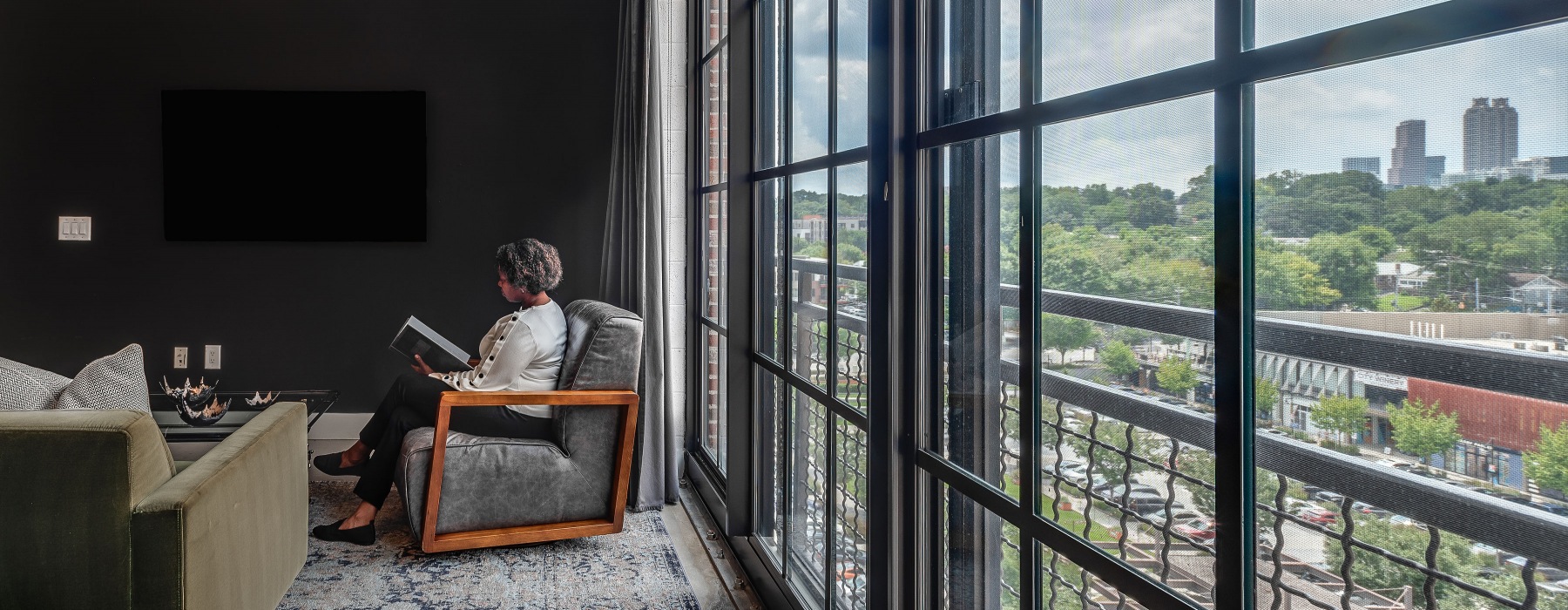 Floor-to-ceiling windows bringing in ample natural lighting inside apartment homes at Flats at Ponce City Market