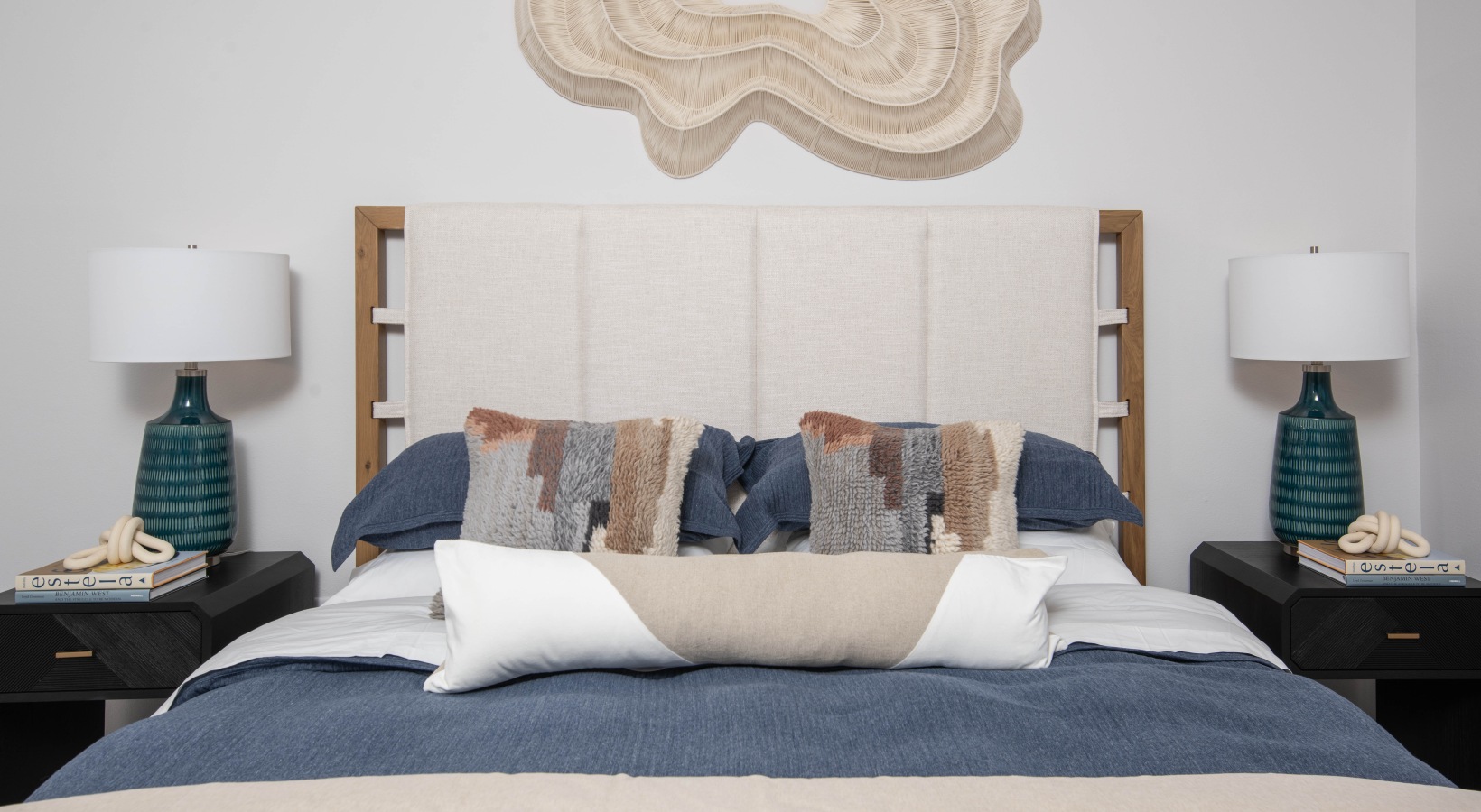 Modern bedroom with natural light inside luxury one-bedroom apartments at Madison Watergrass in Wesley Chapel Florida.