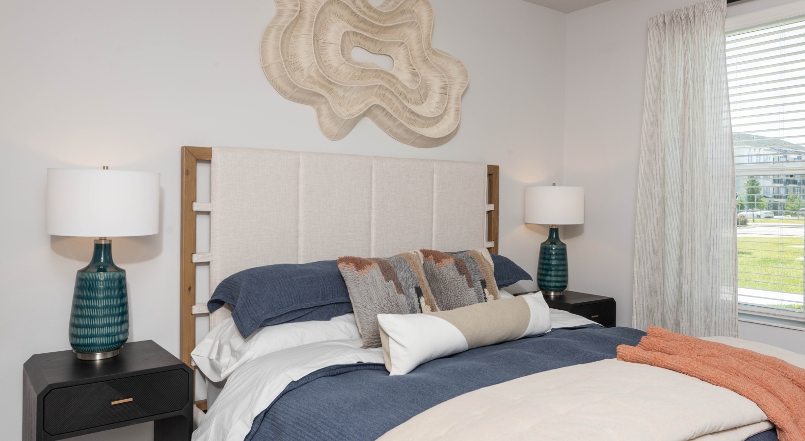Modern bedroom with natural light inside luxury one-bedroom apartments at Madison Watergrass in Wesley Chapel Florida.