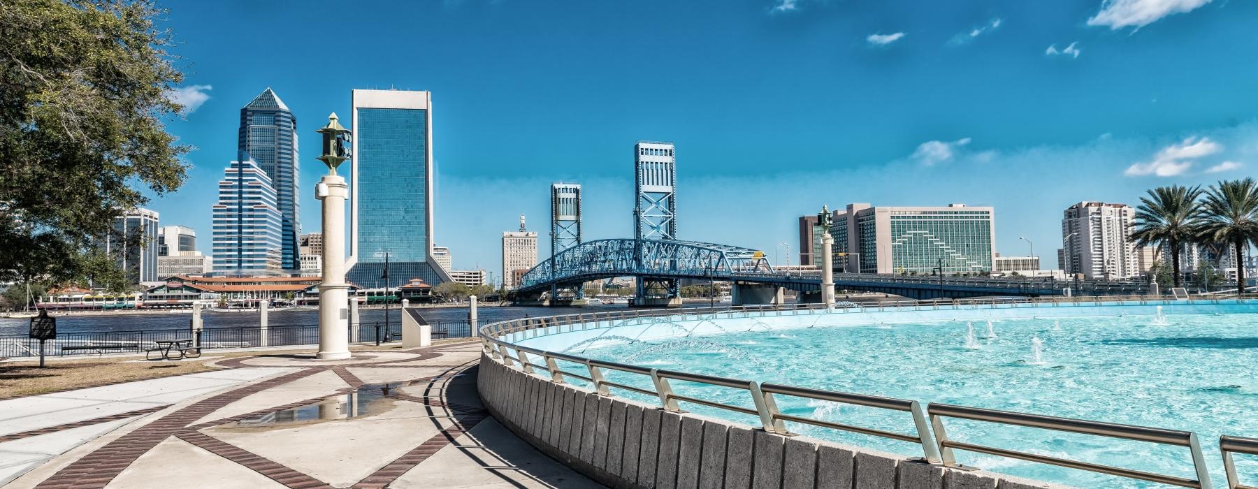 a body of water with a city in the background