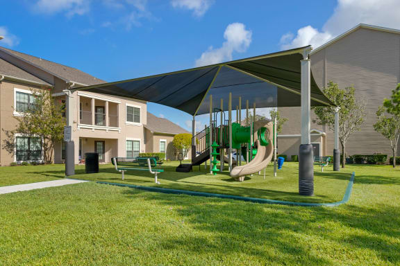 our apartments have a playground with a variety of play equipment at Summerwind, Pearland, Texas