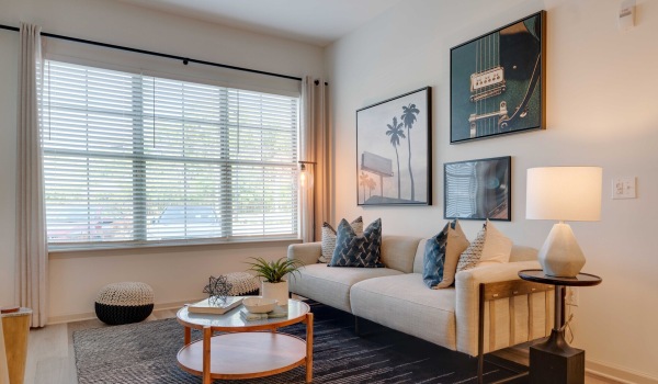 living room with a large window and open spaces