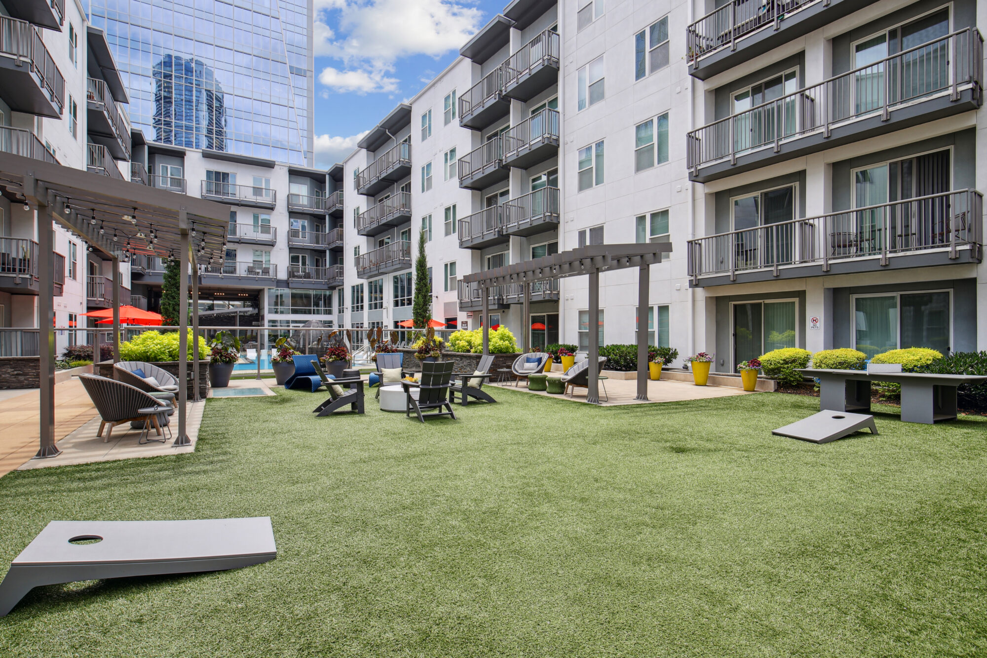 Courtyard with lounge seating and lawn games