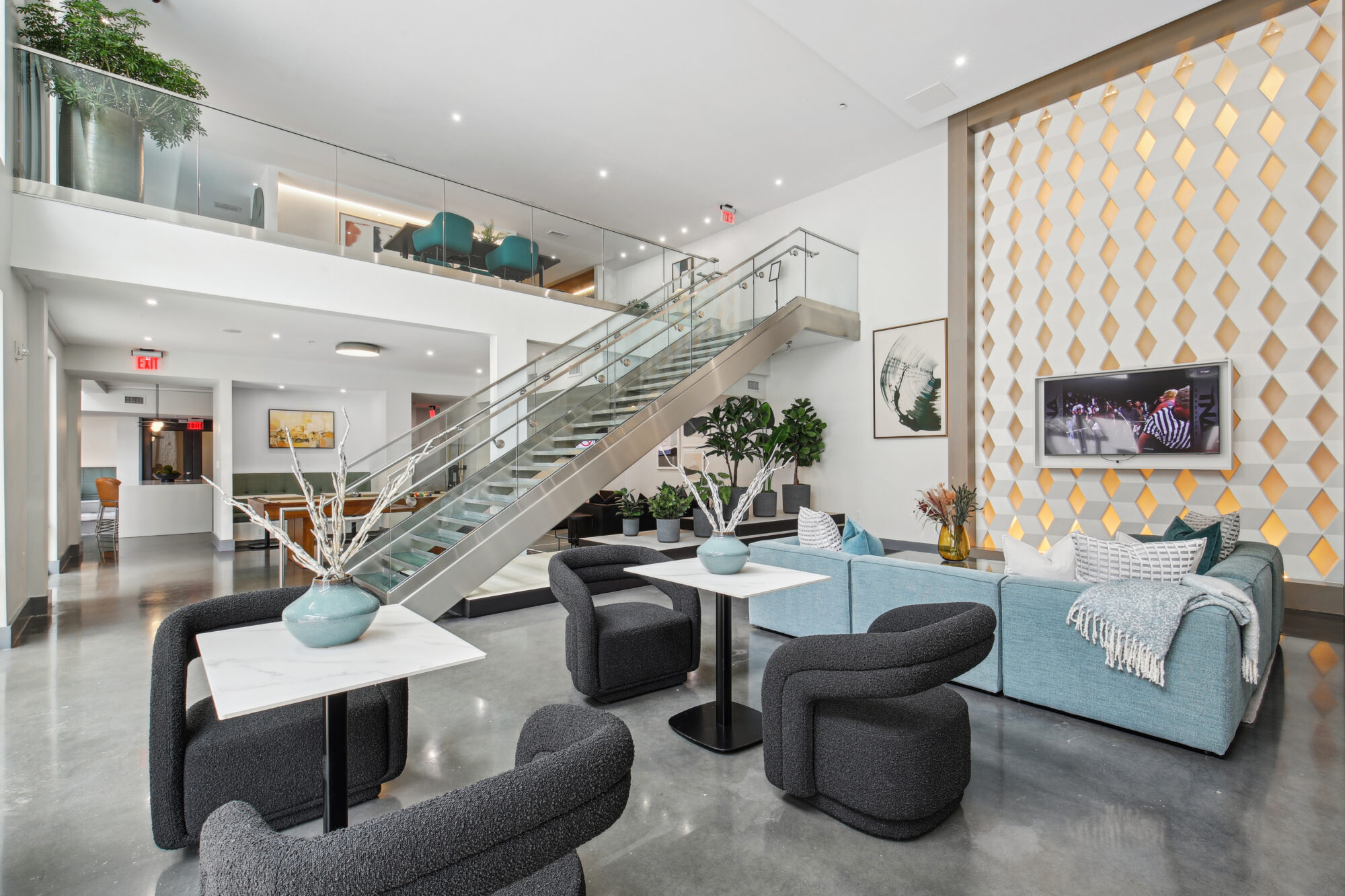 Clubhouse lounge with sofas and TVs
