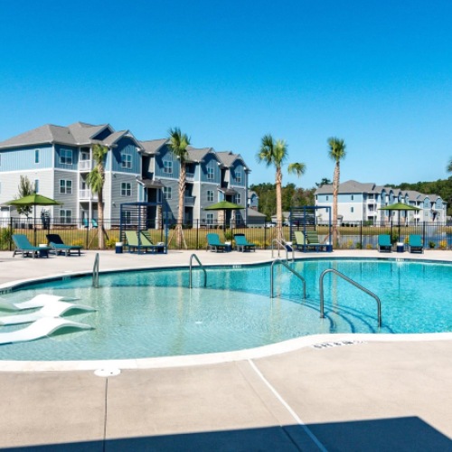 Luxury apartment pool and sundeck designed for relaxation and outdoor enjoyment.
