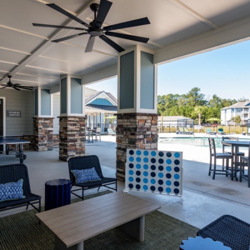 Resident game lounge featuring recreational entertainment and comfortable seating at The Palms at Edgewater.