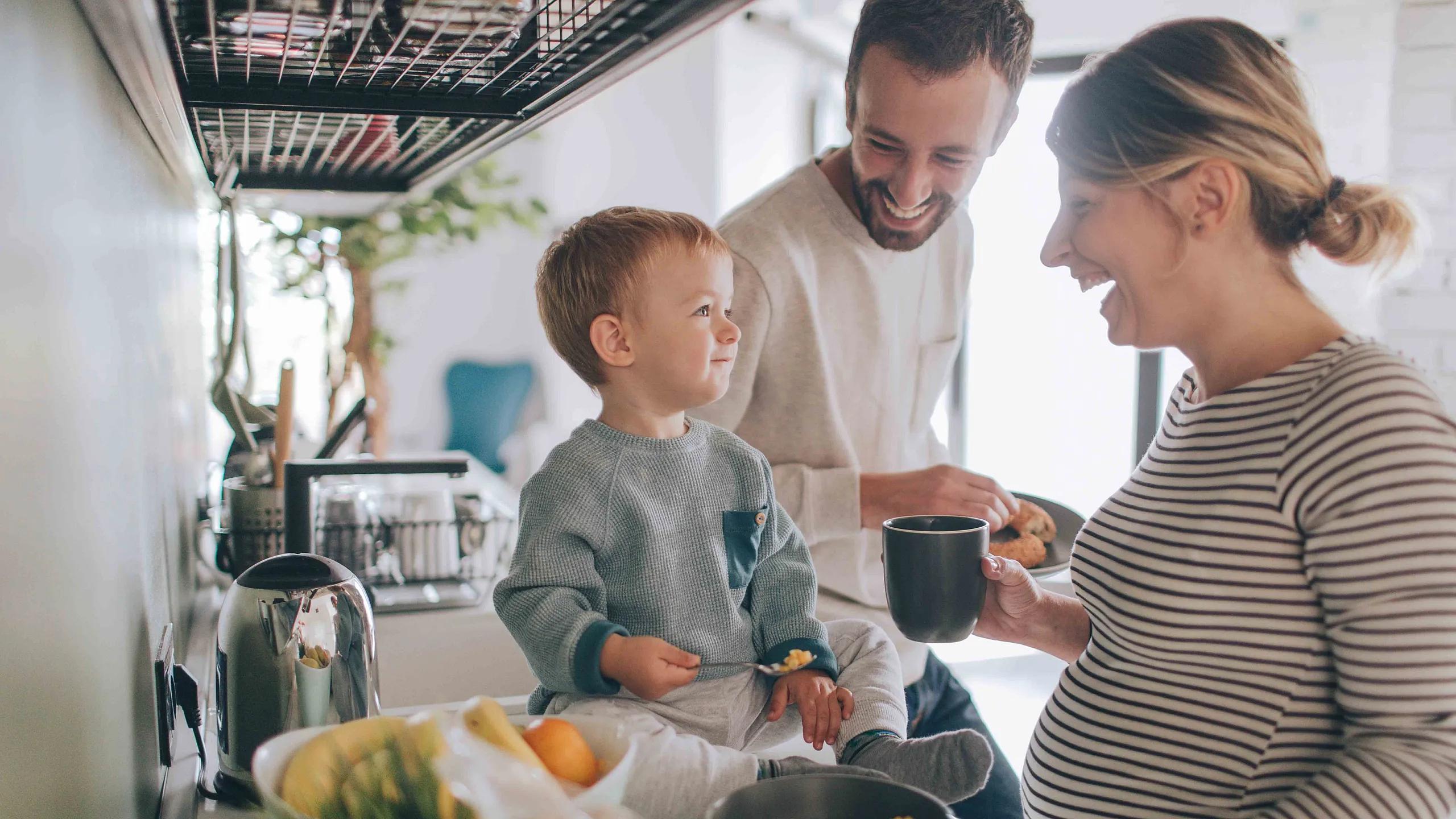 family together in kitchen