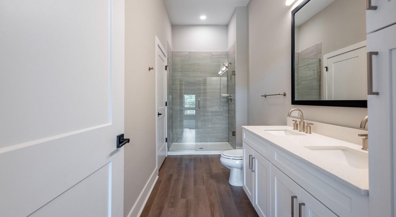 bathroom with sink mirror and shower