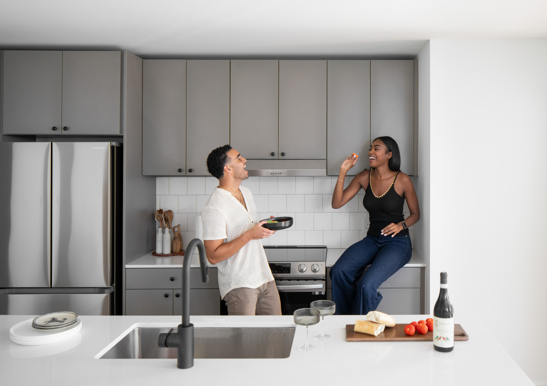 Man and woman interacting together in a kitchen