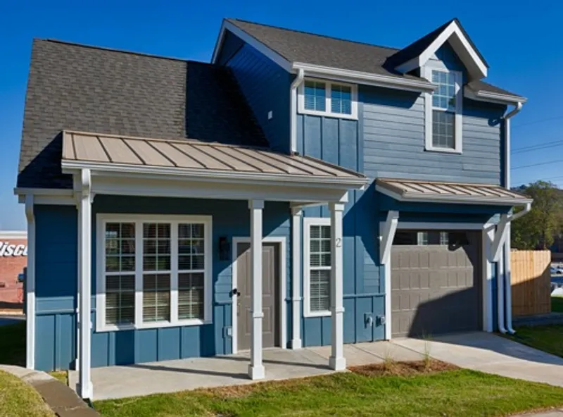 two story home exterior with blue paint