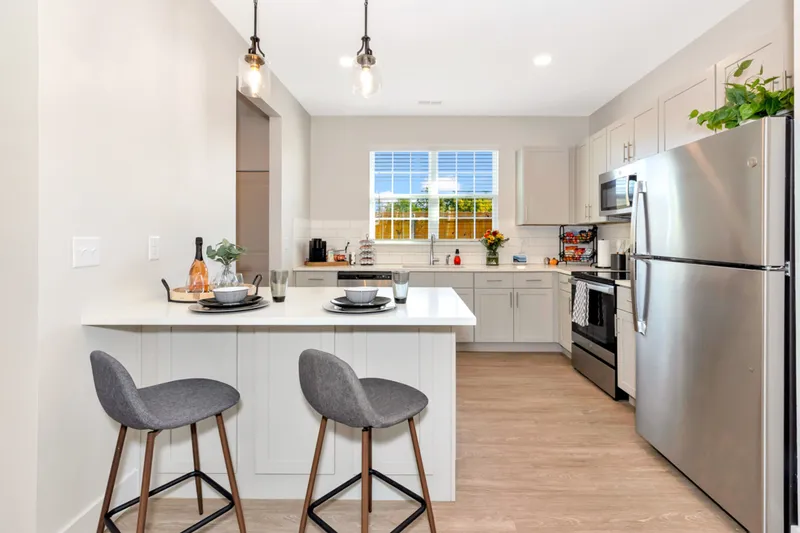 kitchen with white cabinets and breakfast bar