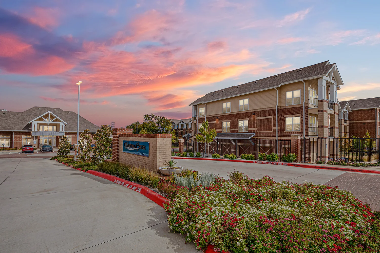 Entrance to Winding Creek at the Preserve apartments at dusk
