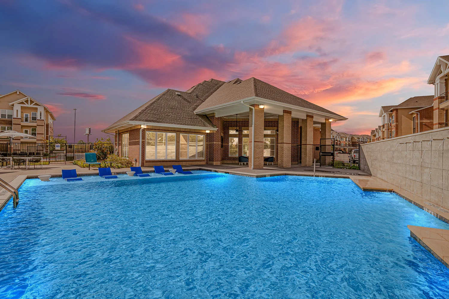 Swimming pool with view of clubhouse at Winding Creek at The Preserve