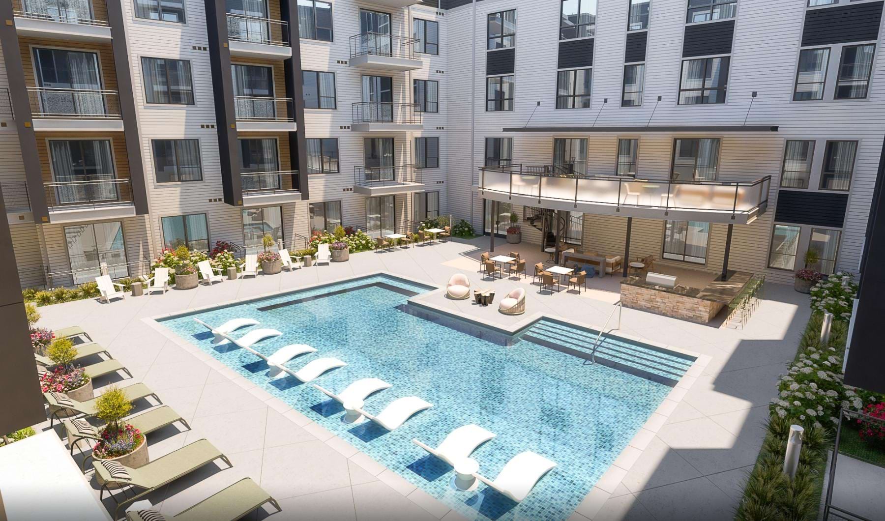 a swimming pool in a courtyard between buildings