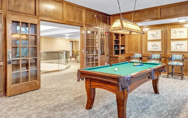 Enjoy a game of billiards in the elegant game room at Lakeview Retirement Community. Our Independent Living options offer a variety of amenities and activities for a vibrant lifestyle.