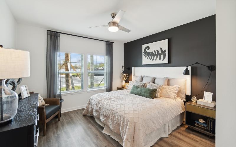 a bedroom with a large window