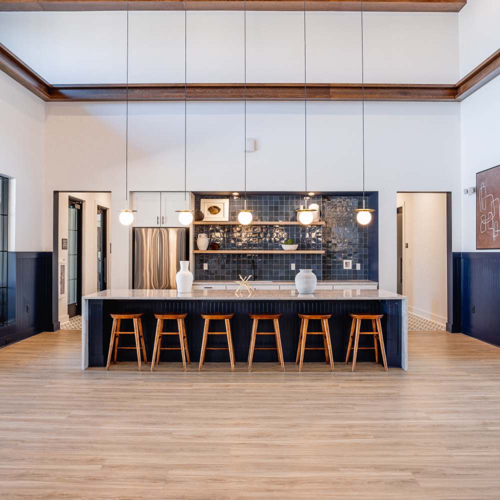 Clubhouse kitchen with island seating at The Flats at Crosspointe in Columbia, South Carolina