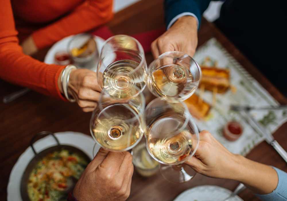  Resident toasting their glasses near Summerville cityscape, near Hutchinson