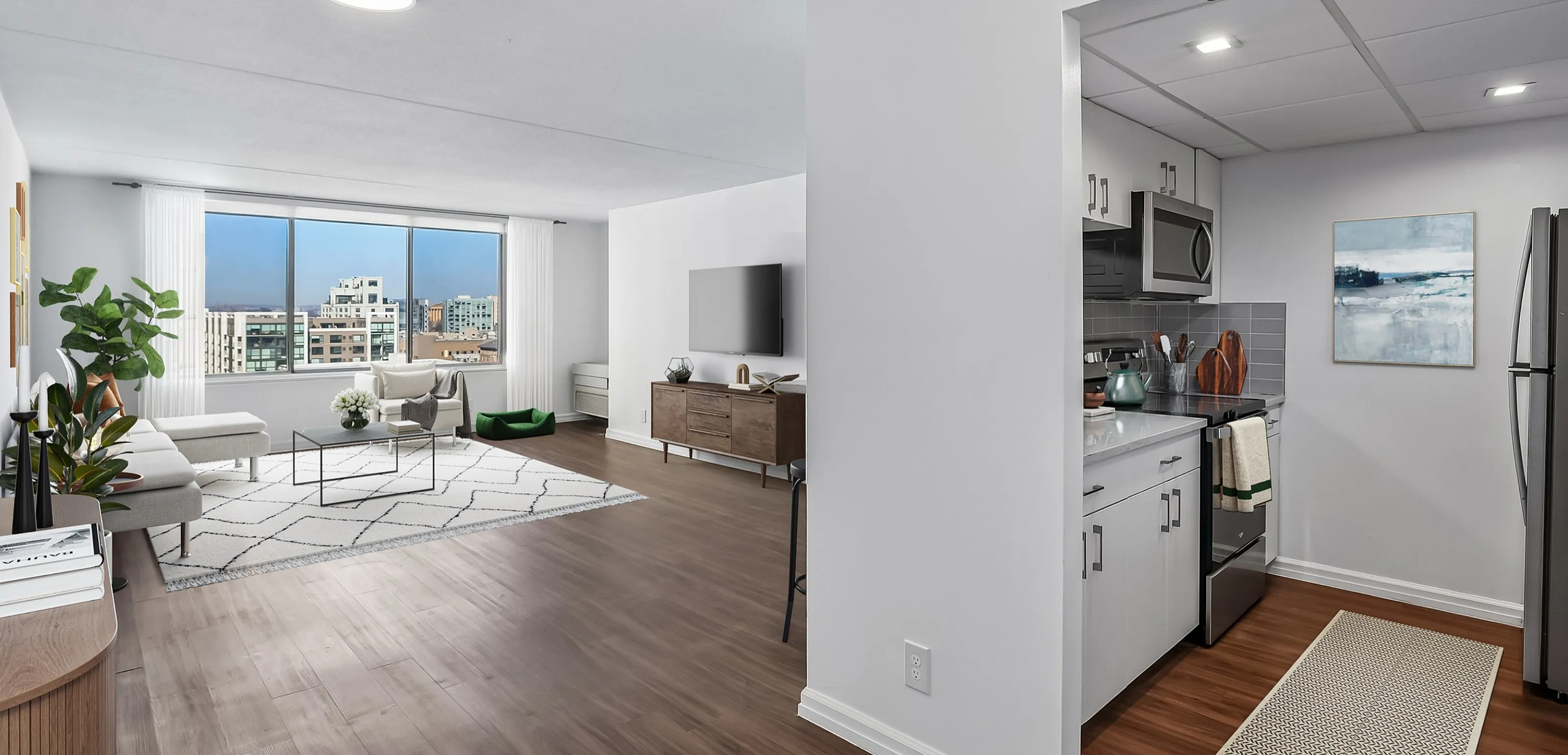 Contemporary city apartment showcasing open-concept living space, modern kitchen, and stunning city views.