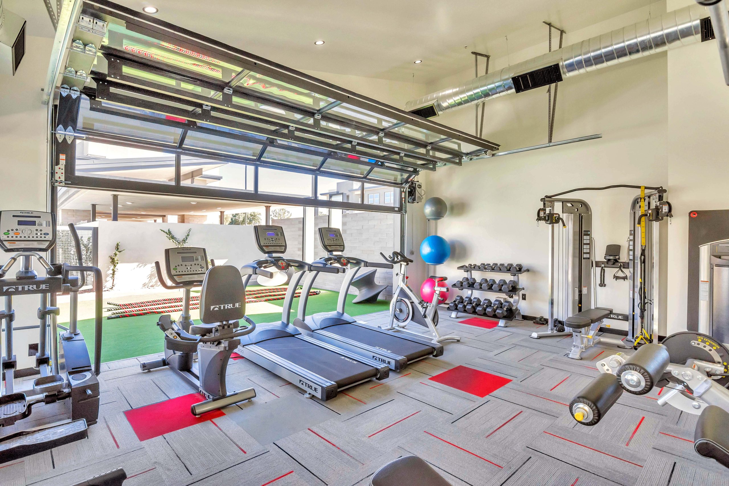 Modern fitness gym featured among community amenities in Mesa AZ.