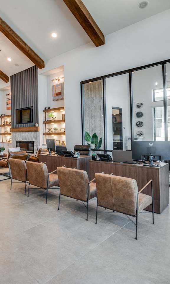A modern living room with a grey sofa and a wooden coffee table.