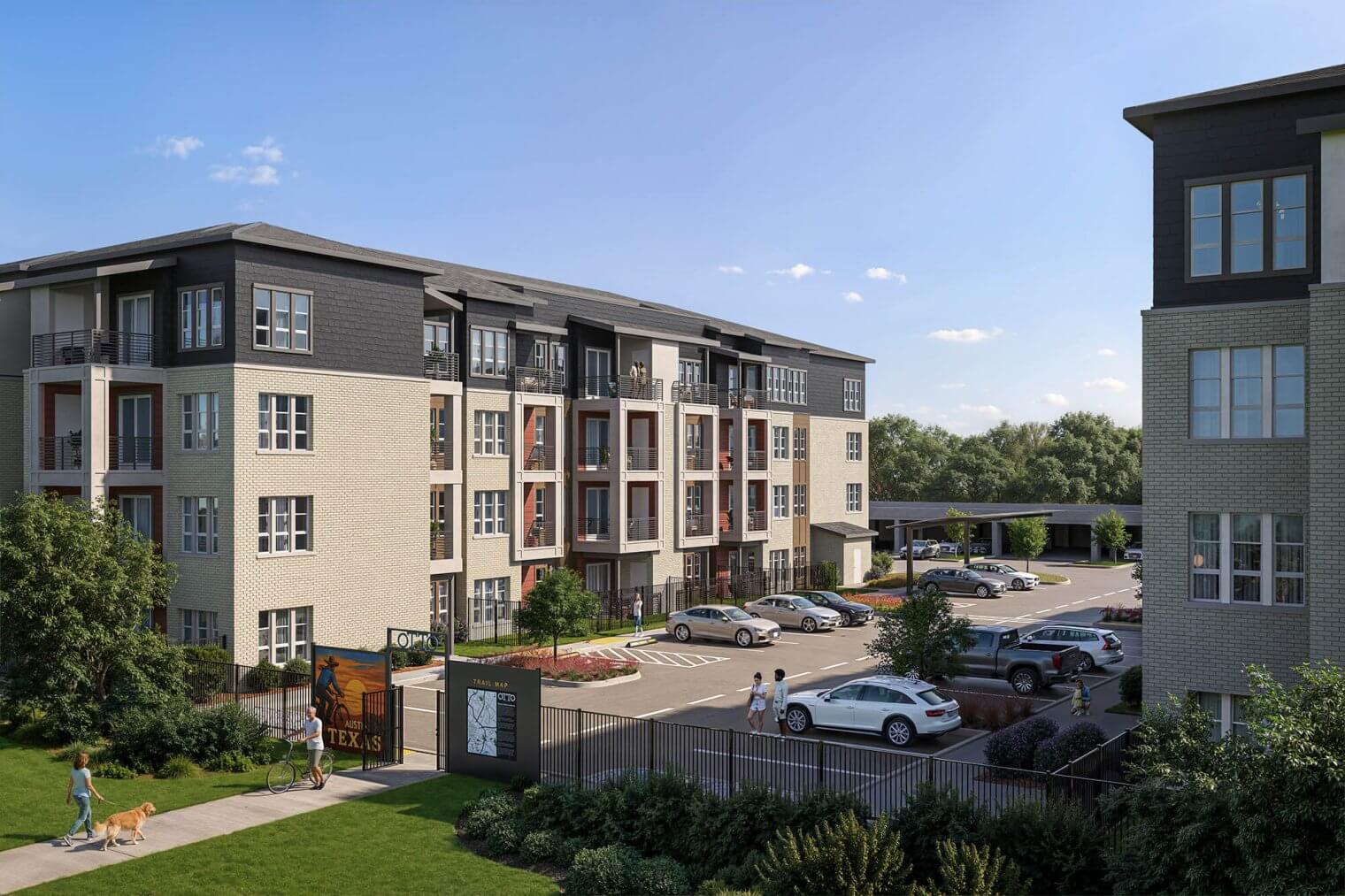 The inviting exterior of Otto on the Trail apartments showing the seamless connection between the community and the lush, wooded trailside.