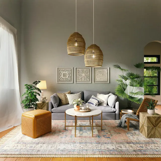 Cozy living room featuring a gray sofa, woven pendant lights, plants, and decorative art on the walls, with natural light coming in.