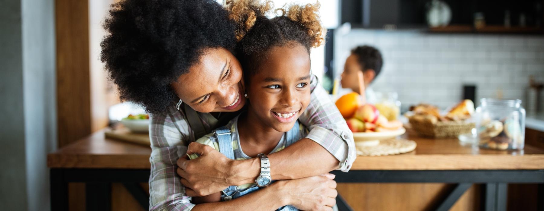 woman hugging a child