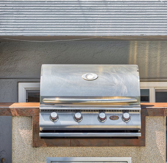 a stainless steel grill on the side of a building