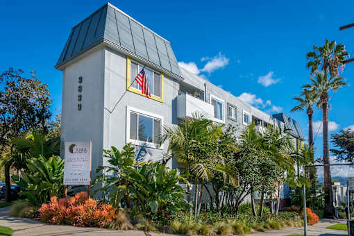 front of building with lush landscaping