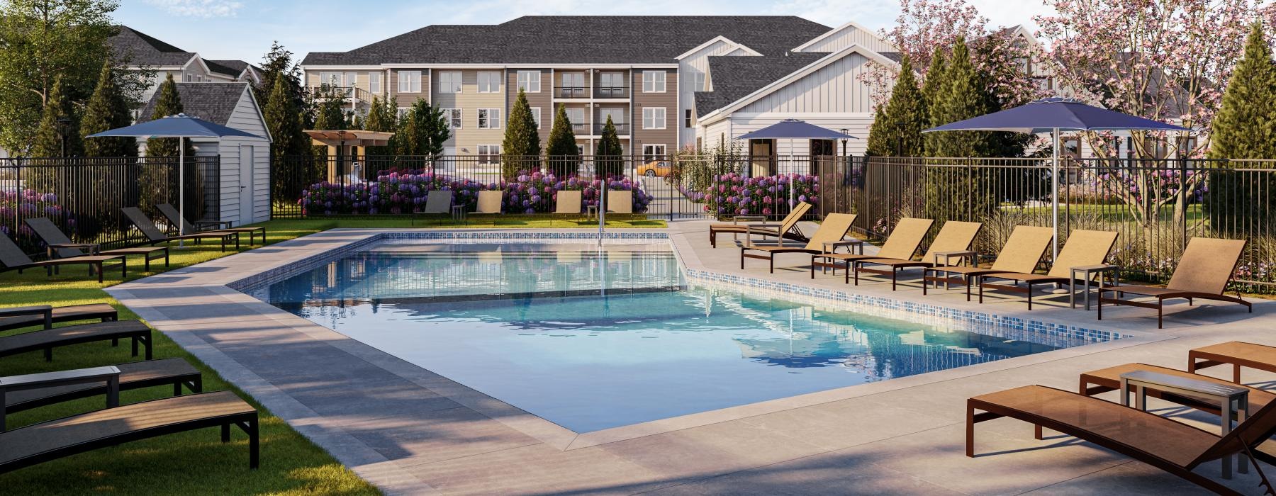 a swimming pool in front of a building complex