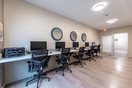 Commons at Manor community business center with computers and a printer