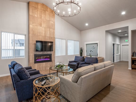 A living room with a fireplace and a television.