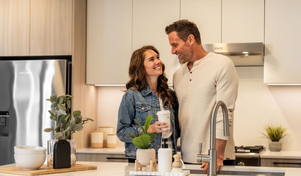 Couple Hugging in Modern Kitchen