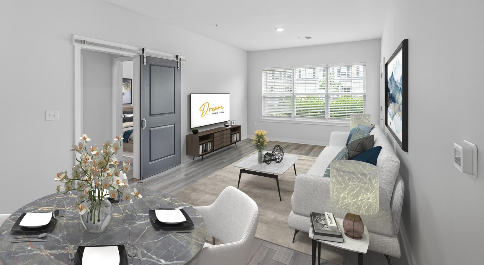 a living room with a tv and couches