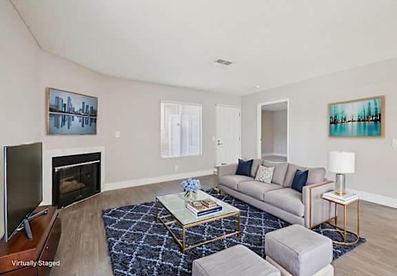 A living room with a fireplace and a couch.
