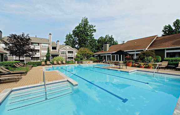 A large swimming pool with a blue line in the middle.