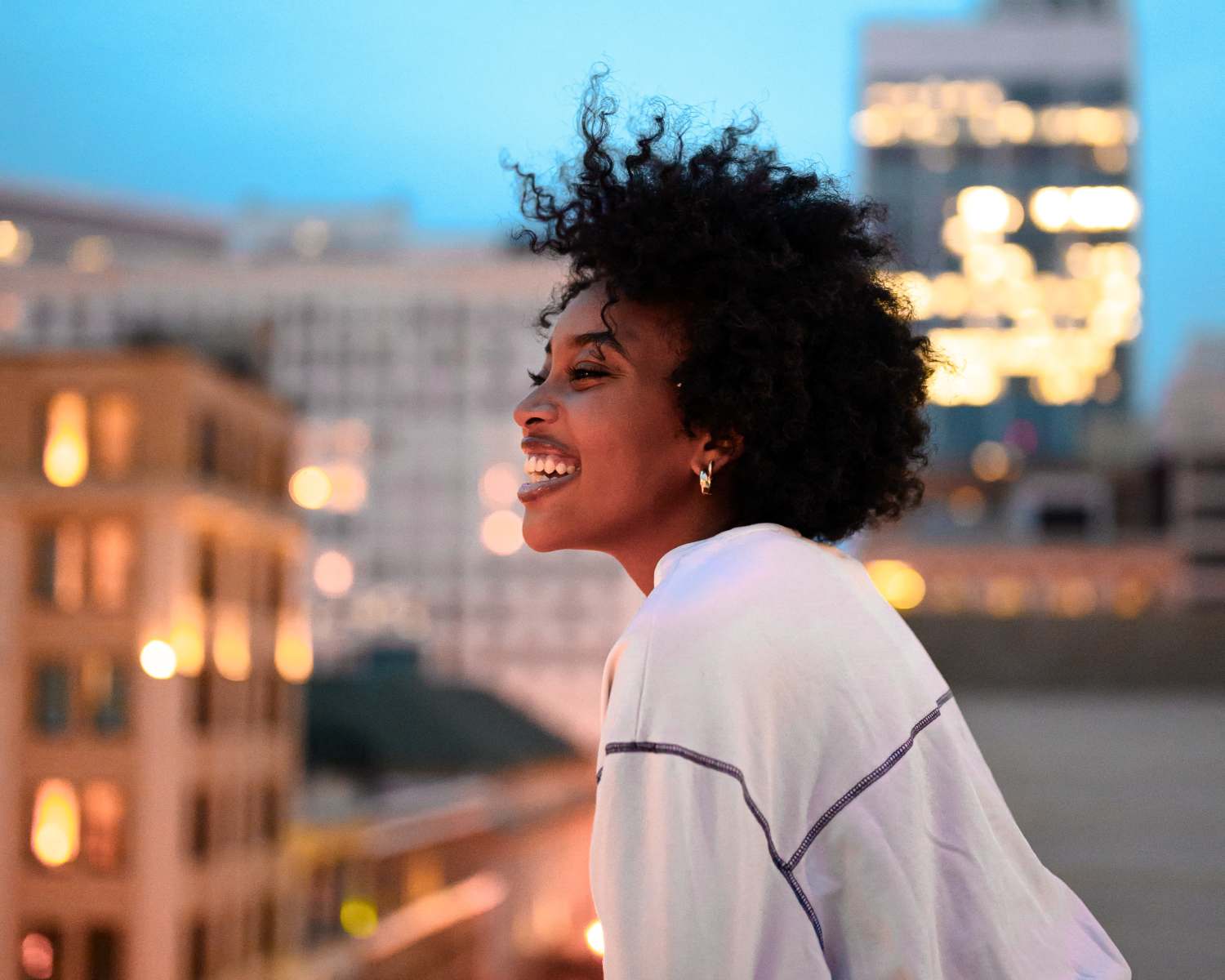 Resident looking at the stunning view from the rooftop at Loria Ansley in Atlanta, Georgia