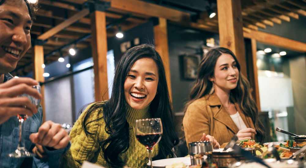 Residents having drinks and delicious food at a restaurant near Point Royale Apartments in Victoria, Texas