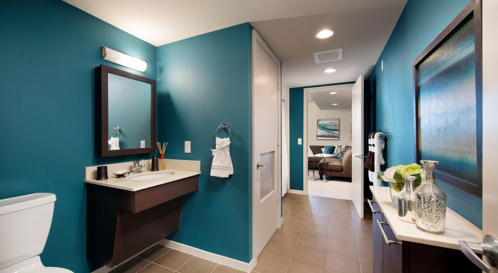 a bathroom with blue walls