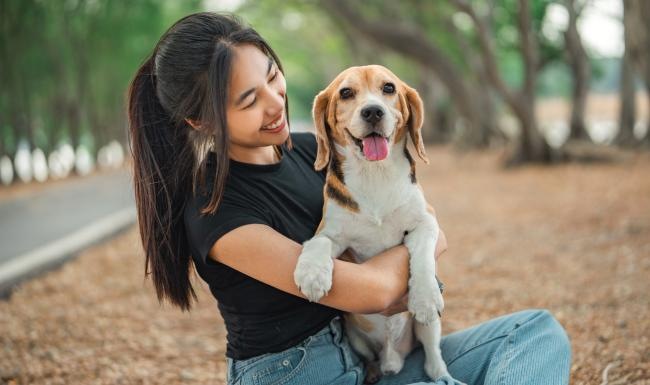 a person holding a dog