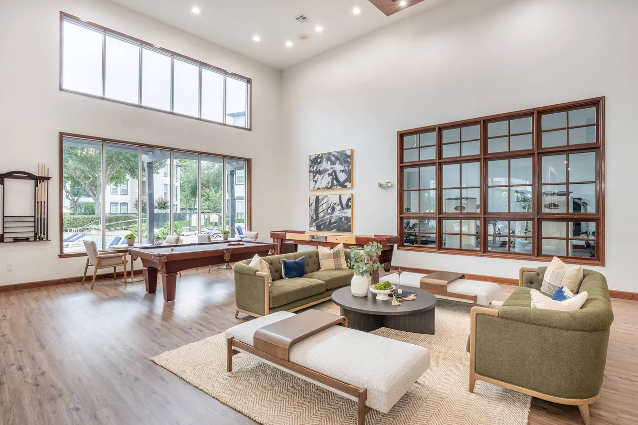 Clubhouse with great room, gourmet kitchen, wine bar, business center, conference room and multiple seating areas with plasma televisions